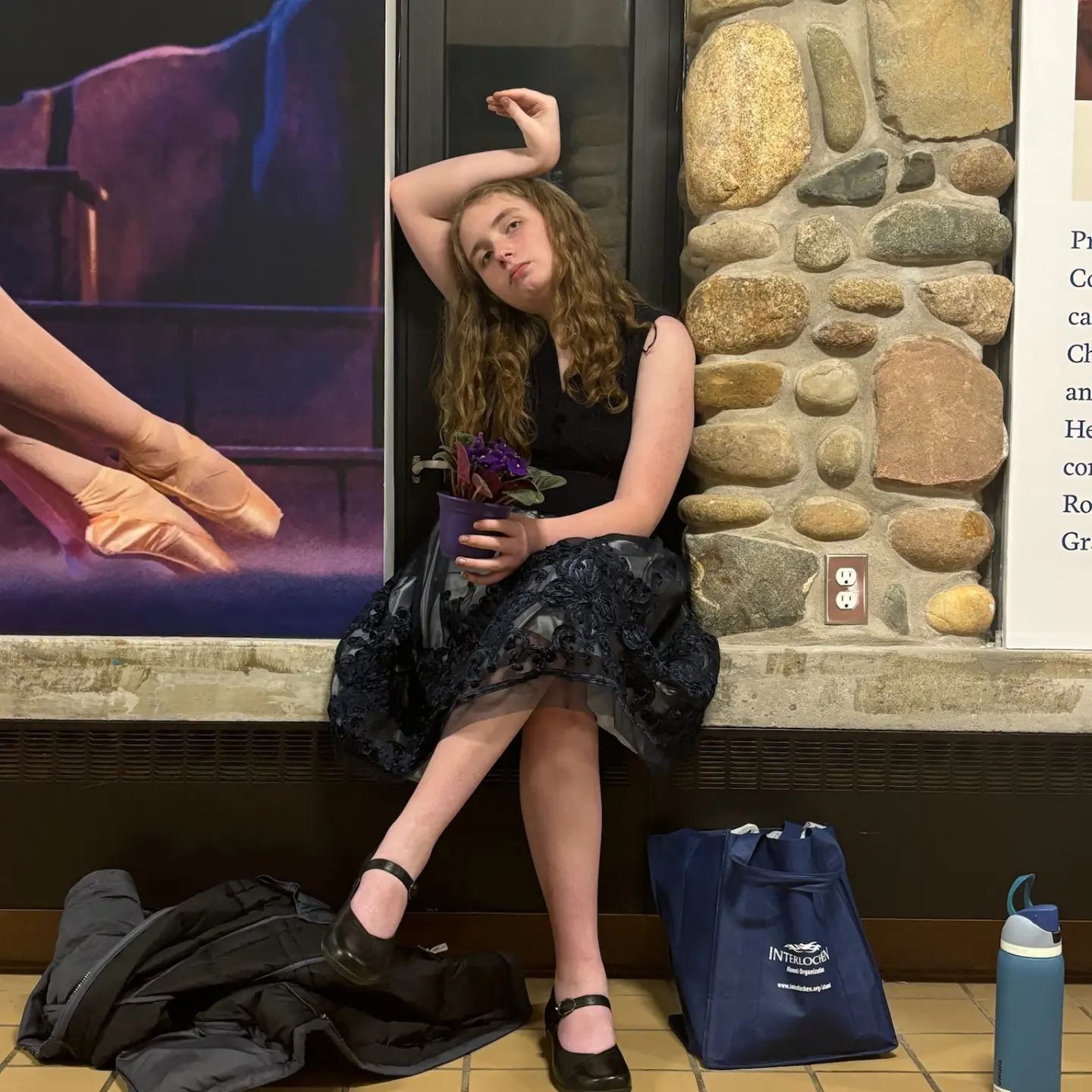 Me sitting in a weird position while holding a violet.